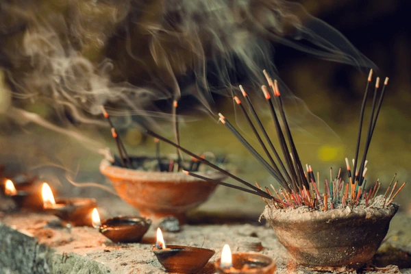 burning-aromatic-incense-sticks-praying-600nw-1012398844
