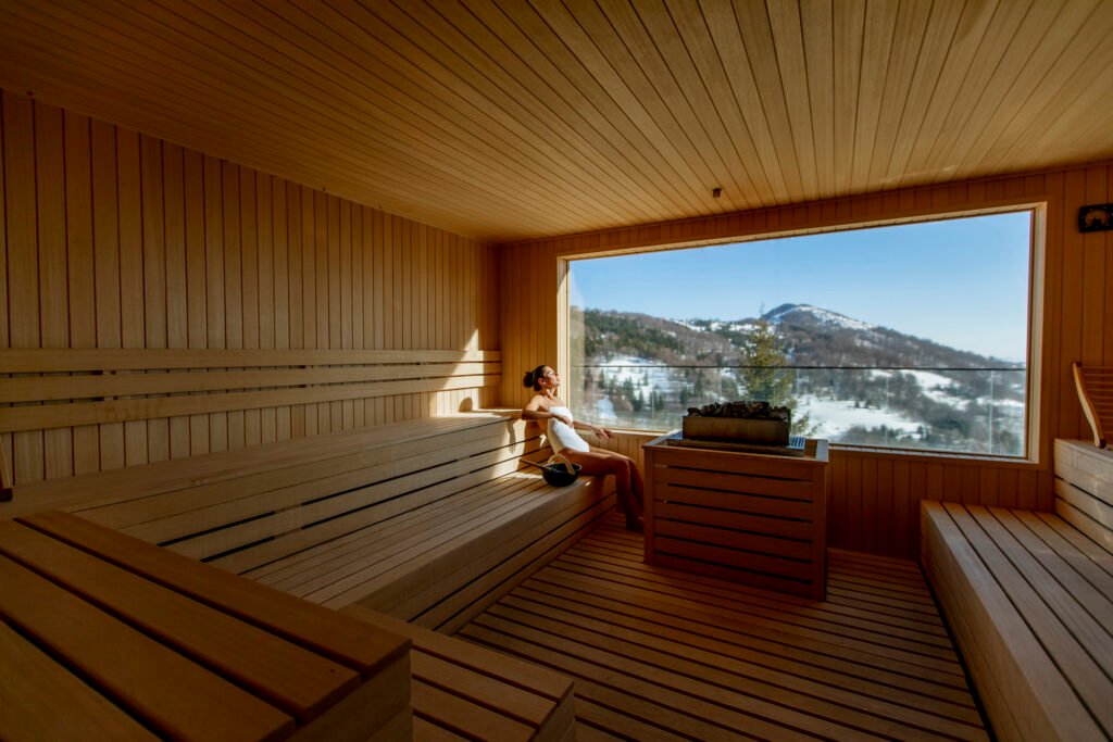 Young woman relaxing in the sauna