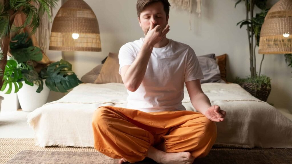 man-practicing-yoga-sitting-making-alternate-nos-2021-09-14-17-35-40-utc-edited-scaled